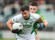 30 September 2023; Oisin Boland of St Mullins in action against Billy Nolan of Fighting Cocks during the Carlow Junior A Football Championship final match between Fighting Cocks GAA Club and St Mullins GAA Club at Netwatch Cullen Park in Carlow. Photo by Matt Browne/Sportsfile