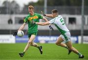 30 September 2023; Matthew English-Hayden of Fighting Cocks in action against Jack Kavanagh of St Mullins during the Carlow Junior A Football Championship final match between Fighting Cocks GAA Club and St Mullins GAA Club at Netwatch Cullen Park in Carlow. Photo by Matt Browne/Sportsfile