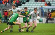 30 September 2023; Paidi O'Shea of St Mullins in action against Billy Nolan and Aaron Bolger of Fighting Cocks during the Carlow Junior A Football Championship final match between Fighting Cocks GAA Club and St Mullins GAA Club at Netwatch Cullen Park in Carlow. Photo by Matt Browne/Sportsfile