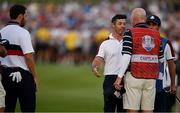 30 September 2023; Rory McIlroy of Europe speaks to Joe LaCava, caddie for Patrick Cantlay of USA, left, after their match during the afternoon fourball matches on day two of the 2023 Ryder Cup at Marco Simone Golf and Country Club in Rome, Italy. Photo by Brendan Moran/Sportsfile