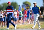 1 October 2023; Rory McIlroy of Europe and Sam Burns of USA during the singles matches on the final day of the 2023 Ryder Cup at Marco Simone Golf and Country Club in Rome, Italy. Photo by Ramsey Cardy/Sportsfile