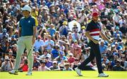 1 October 2023; Sam Burns of USA and Rory McIlroy of Europe on the eighth green during the singles matches on the final day of the 2023 Ryder Cup at Marco Simone Golf and Country Club in Rome, Italy. Photo by Ramsey Cardy/Sportsfile