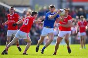 1 October 2023; John Heslin of St Loman's is tackled by Eoin O'Brien, left, and Darren Giles of Coralstown-Kinnegad during the Westmeath County Senior Club Football Championship final match between St Loman's and Coralstown-Kinnegad at TEG Cusack Park in Mullingar, Westmeath. Photo by Ben McShane/Sportsfile