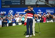 1 October 2023; Rory McIlroy of Europe with Sam Burns of USA on the 18th green during the singles matches on the final day of the 2023 Ryder Cup at Marco Simone Golf and Country Club in Rome, Italy. Photo by Ramsey Cardy/Sportsfile