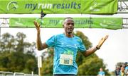 1 October 2023; Kahumburuka Ivan Tuahuku, originally from Botswana, celebrates winning the Permanent TSB Sanctuary Run 2023 at the Cross Country track of the Sport Ireland Campus in Dublin. The Permanent TSB Sanctuary Run on the Sport Ireland campus attracted nearly 1,000 participants including refugees from Direct Provision centres across Ireland, Ukrainian people in Dublin, locals and Irish Olympians. The event, to celebrate diversity and interculturalism in Ireland today, was run by the Sanctuary Runners’ organisation and supported by the Olympic Federation of Ireland and Athletics Ireland. Photo by Stephen McCarthy/Sportsfile