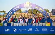 1 October 2023; Team Europe captain Luke Donald, centre, lifts the Ryder cup with his team, from left, Tommy Fleetwood, Sepp Straka, Shane Lowry, Matt Fitzpatrick, Justin Rose, Tyrrell Hatton, Nicolai Højgaard, Rory McIlroy, Viktor Hovland, Ludvig Åberg, Robert MacIntyre and Jon Rahm during the singles matches on the final day of the 2023 Ryder Cup at Marco Simone Golf and Country Club in Rome, Italy. Photo by Ramsey Cardy/Sportsfile