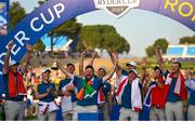 1 October 2023; Shane Lowry, centre, and Rory McIlroy of Europe, right, celebrate with the Ryder cup after the singles matches on the final day of the 2023 Ryder Cup at Marco Simone Golf and Country Club in Rome, Italy. Photo by Brendan Moran/Sportsfile