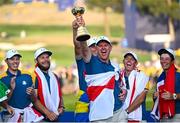 1 October 2023; Justin Rose of Europe lifts the trophy after the final day of the 2023 Ryder Cup at Marco Simone Golf and Country Club in Rome, Italy. Photo by Ramsey Cardy/Sportsfile