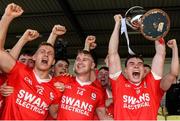 1 October 2023; Éire Óg captain Jordan Morrissey lifts the cup as his team-mates celebrate after the Carlow County Senior Club Football Championship final match between Tinryland and Éire Óg at Netwatch Cullen Park in Carlow. Photo by Matt Browne/Sportsfile