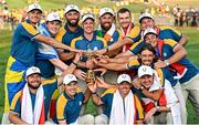 1 October 2023; Team Europe captain Luke Donald, centre, with the Ryder cup alongside his team, back row, from left, Ludvig Åberg, Robert MacIntyre, Jon Rahm, Shane Lowry, Nicolai Højgaard, Sepp Straka, Viktor Hovland, front row, from left, Tyrrell Hatton, Matt Fitzpatrick, Rory McIlroy, Justin Rose and Tommy Fleetwood during the singles matches on the final day of the 2023 Ryder Cup at Marco Simone Golf and Country Club in Rome, Italy. Photo by Ramsey Cardy/Sportsfile