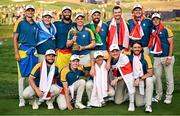 1 October 2023; Team Europe captain Luke Donald, centre, with the Ryder cup alongside his team, back row, from left, Ludvig Åberg, Robert MacIntyre, Jon Rahm, Shane Lowry, Nicolai Højgaard, Sepp Straka, Viktor Hovland, front row, from left, Tyrrell Hatton, Matt Fitzpatrick, Rory McIlroy, Justin Rose and Tommy Fleetwood during the singles matches on the final day of the 2023 Ryder Cup at Marco Simone Golf and Country Club in Rome, Italy. Photo by Ramsey Cardy/Sportsfile