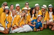 1 October 2023; Viktor Hovland of Europe with the wives and partners of his teammates after the singles matches on the final day of the 2023 Ryder Cup at Marco Simone Golf and Country Club in Rome, Italy. Photo by Ramsey Cardy/Sportsfile
