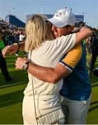 1 October 2023; Rory McIlroy of Europe celebrates with Wendy Iris Lowry, wife of teammate Shane Lowry, after the singles matches on the final day of the 2023 Ryder Cup at Marco Simone Golf and Country Club in Rome, Italy. Photo by Brendan Moran/Sportsfile