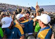 1 October 2023; Shane Lowry of Europe celebrates with vice captain Nicolas Colsaerts and Rory McIlroy after the singles matches on the final day of the 2023 Ryder Cup at Marco Simone Golf and Country Club in Rome, Italy. Photo by Brendan Moran/Sportsfile