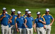 1 October 2023; Europe captain Luke Donald, and Rory McIlroy of Europe watch on as Max Homa of USA chips onto the 18th green during the singles matches on the final day of the 2023 Ryder Cup at Marco Simone Golf and Country Club in Rome, Italy. Photo by Ramsey Cardy/Sportsfile