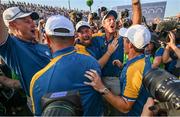1 October 2023; Team Europe players, from left, Justin Rose, Shane Lowry, vice captain Nicolas Colsaerts and Rory McIlroy celebrate after the singles matches on the final day of the 2023 Ryder Cup at Marco Simone Golf and Country Club in Rome, Italy. Photo by Brendan Moran/Sportsfile