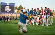 1 October 2023; A caddie takes a photo of the Europe team with the Ryder Cup after the singles matches on the final day of the 2023 Ryder Cup at Marco Simone Golf and Country Club in Rome, Italy. Photo by Brendan Moran/Sportsfile