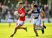 1 October 2023; Ross Dunphy of Éire Óg in action against Jonah Dunne of Tinryland during the Carlow County Senior Club Football Championship final match between Tinryland and Éire Óg at Netwatch Cullen Park in Carlow. Photo by Matt Browne/Sportsfile