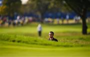 1 October 2023; Xander Schauffele of USA checks the pin placement from a bunker on the ninth green during the singles matches on the final day of the 2023 Ryder Cup at Marco Simone Golf and Country Club in Rome, Italy. Photo by Brendan Moran/Sportsfile