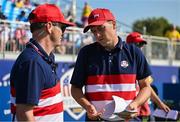 1 October 2023; Jordan Spieth of USA discusses options with USA captain Zach Johnson on the seventh tee box during the singles matches on the final day of the 2023 Ryder Cup at Marco Simone Golf and Country Club in Rome, Italy. Photo by Brendan Moran/Sportsfile