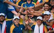 1 October 2023; Team Europe players, from left, Tyrrell Hatton, Matt Fitzpatrick, Rory McIlroy, Justin Rose, Tommy Fleetwood and Viktor Hovland celebrate with the Ryder Cup after the final day of the 2023 Ryder Cup at Marco Simone Golf and Country Club in Rome, Italy. Photo by Brendan Moran/Sportsfile