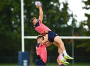 3 October 2023; Garry Ringrose is lifted by Josh van der Flier during an Ireland Rugby squad training session at Complexe de la Chambrerie in Tours, France. Photo by Harry Murphy/Sportsfile