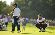 30 September 2023; Patrick Cantlay of USA, right, and Rory McIlroy of Europe on the ninth green during the afternoon fourball matches on day two of the 2023 Ryder Cup at Marco Simone Golf and Country Club in Rome, Italy. Photo by Brendan Moran/Sportsfile