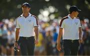 30 September 2023; Rory McIlroy, left, and Matt Fitzpatrick of Europe during the afternoon fourball matches on day two of the 2023 Ryder Cup at Marco Simone Golf and Country Club in Rome, Italy. Photo by Brendan Moran/Sportsfile