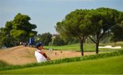30 September 2023; Rory McIlroy of Europe watches his shot from a bunker at the sixth green during the afternoon fourball matches on day two of the 2023 Ryder Cup at Marco Simone Golf and Country Club in Rome, Italy. Photo by Brendan Moran/Sportsfile