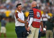 30 September 2023; Rory McIlroy of Europe shakes hands with Joe LaCava, caddie of Patrick Cantlay of USA, after finishing on the 18th green during the afternoon fourball matches on day two of the 2023 Ryder Cup at Marco Simone Golf and Country Club in Rome, Italy. Photo by Brendan Moran/Sportsfile