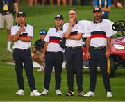 30 September 2023; Team USA players, from left, Collin Morikawa, Brian Harman, Justin Thomas and Max Homa watch as teammate Patrick Cantlay, not pictured, putts on the 18th green during the afternoon fourball matches on day two of the 2023 Ryder Cup at Marco Simone Golf and Country Club in Rome, Italy. Photo by Brendan Moran/Sportsfile