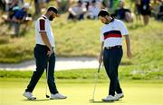 30 September 2023; Patrick Cantlay of USA, right, and Jon Rahm of Europe on the ninth green during the morning foursomes on day two of the 2023 Ryder Cup at Marco Simone Golf and Country Club in Rome, Italy. Photo by Brendan Moran/Sportsfile