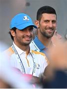 29 September 2023; Formula One driver Carlos Sainz, left, and professional tennis player Novak Djokovic during the morning foursomes matches on day one of the 2023 Ryder Cup at Marco Simone Golf and Country Club in Rome, Italy. Photo by Brendan Moran/Sportsfile