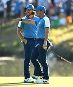 29 September 2023; Tommy Fleetwood, left, and Rory McIlroy of Europe during the morning foursomes matches on day one of the 2023 Ryder Cup at Marco Simone Golf and Country Club in Rome, Italy. Photo by Brendan Moran/Sportsfile