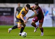 6 October 2023; Adam O'Reilly of Derry City in action against Gary Deegan of Drogheda United during the SSE Airtricity Men's Premier Division match between Drogheda United and Derry City at Weaver's Park in Drogheda, Louth. Photo by Ben McShane/Sportsfile