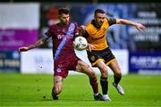 6 October 2023; Michael Duffy of Derry City is tackled by Adam Foley of Drogheda United during the SSE Airtricity Men's Premier Division match between Drogheda United and Derry City at Weaver's Park in Drogheda, Louth. Photo by Ben McShane/Sportsfile