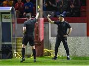6 October 2023; Dundalk head coach Stephen O'Donnell is shown a yellow card by referee Eoghan O'Shea during the SSE Airtricity Men's Premier Division match between Shelbourne and Dundalk at Tolka Park in Dublin. Photo by Stephen McCarthy/Sportsfile