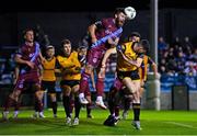 6 October 2023; Gary Deegan of Drogheda United heads clear ahead of Cian Kavanagh of Derry City during the SSE Airtricity Men's Premier Division match between Drogheda United and Derry City at Weaver's Park in Drogheda, Louth. Photo by Ben McShane/Sportsfile
