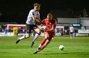 6 October 2023; Archie Davies of Dundalk in action against Paddy Barrett of Shelbourne during the SSE Airtricity Men's Premier Division match between Shelbourne and Dundalk at Tolka Park in Dublin. Photo by Stephen McCarthy/Sportsfile
