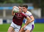 7 October 2023; James O'Kane of Raheny in action against Theo Clancy of Kilmacud Crokes during the Dublin County Senior Club Championship Football Semi-Final match between Kilmacud Crokes and Raheny at Parnell Park in Dublin. Photo by Stephen Marken/Sportsfile