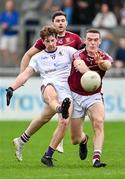 7 October 2023; Liam Flatman of Kilmacud Crokes scores a point despite pressure from Brian Fenton of Raheny during the Dublin County Senior Club Championship Football Semi-Final match between Kilmacud Crokes and Raheny at Parnell Park in Dublin. Photo by Stephen Marken/Sportsfile