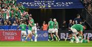 7 October 2023; James Lowe of Ireland, second from left, celebrates with teammates Dan Sheehan, right, and Jamison Gibson-Park after scoring their side's first try during the 2023 Rugby World Cup Pool B match between Ireland and Scotland at the Stade de France in Paris, France. Photo by Brendan Moran/Sportsfile
