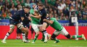 7 October 2023; Finn Russell of Scotland is tackled by Tadhg Beirne, left, and Caelan Doris during the 2023 Rugby World Cup Pool B match between Ireland and Scotland at the Stade de France in Paris, France. Photo by Brendan Moran/Sportsfile