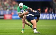 7 October 2023; Mack Hansen of Ireland is tackled by Huw Jones of Scotland during the 2023 Rugby World Cup Pool B match between Ireland and Scotland at the Stade de France in Paris, France. Photo by Harry Murphy/Sportsfile