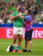 7 October 2023; James Lowe of Ireland receives medical attention from Ireland lead physiotherapist Stephen Mutch for an injury to his eye during the 2023 Rugby World Cup Pool B match between Ireland and Scotland at the Stade de France in Paris, France. Photo by Harry Murphy/Sportsfile