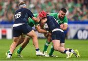 7 October 2023; Josh van der Flier of Ireland is tackled by WP Nel, left, and Ewan Ashman of Scotland during the 2023 Rugby World Cup Pool B match between Ireland and Scotland at the Stade de France in Paris, France. Photo by Harry Murphy/Sportsfile