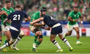 7 October 2023; Caelan Doris of Ireland is tackled by Finn Russell of Scotland during the 2023 Rugby World Cup Pool B match between Ireland and Scotland at the Stade de France in Paris, France. Photo by Harry Murphy/Sportsfile