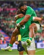 7 October 2023; Garry Ringrose of Ireland, left, is congratulated by teammate Bundee Aki after scoring their side's sixth try during the 2023 Rugby World Cup Pool B match between Ireland and Scotland at the Stade de France in Paris, France. Photo by Brendan Moran/Sportsfile