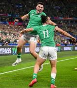 7 October 2023; James Lowe of Ireland, 11, celebrates with teammate Dan Sheehan after scoring their side's first try during the 2023 Rugby World Cup Pool B match between Ireland and Scotland at the Stade de France in Paris, France. Photo by Harry Murphy/Sportsfile