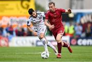 7 October 2023; David Hurley of Galway United in action against Jordan Flores of Bohemians during the Sports Direct Men’s FAI Cup semi-final match between Galway United and Bohemians at Eamonn Deacy Park in Galway. Photo by Stephen McCarthy/Sportsfile